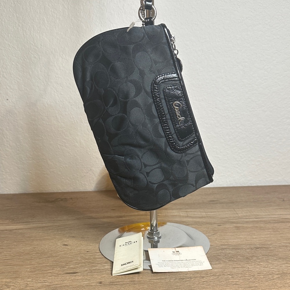 Coach Black Monogram Wristlet. Good condition zipper works perfectly